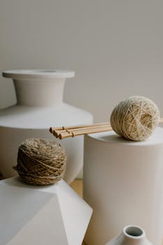Elegant composition of pottery and jute twine highlighting simplicity and rustic charm.